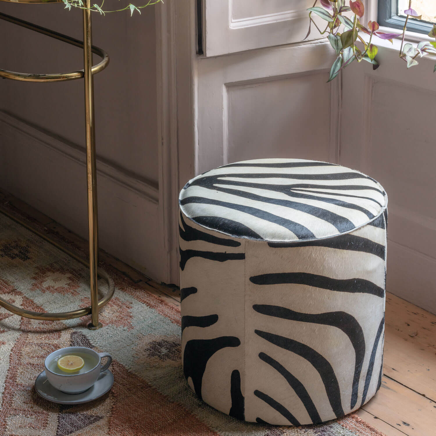 Read more about Graham and green round zebra print pouffe