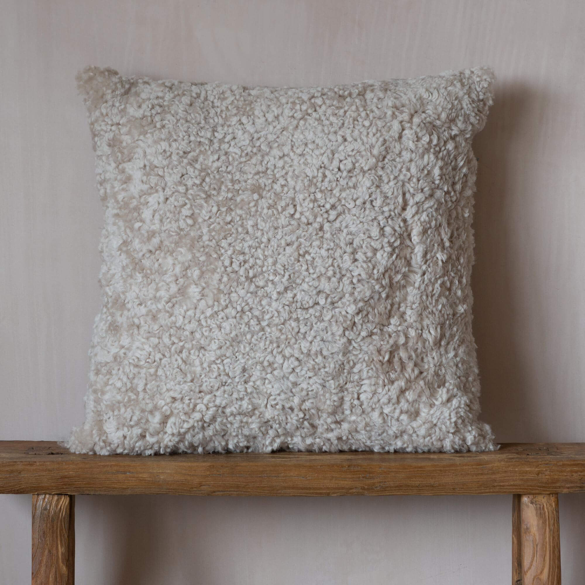 Read more about Graham and green eggshell curly sheepskin square cushion