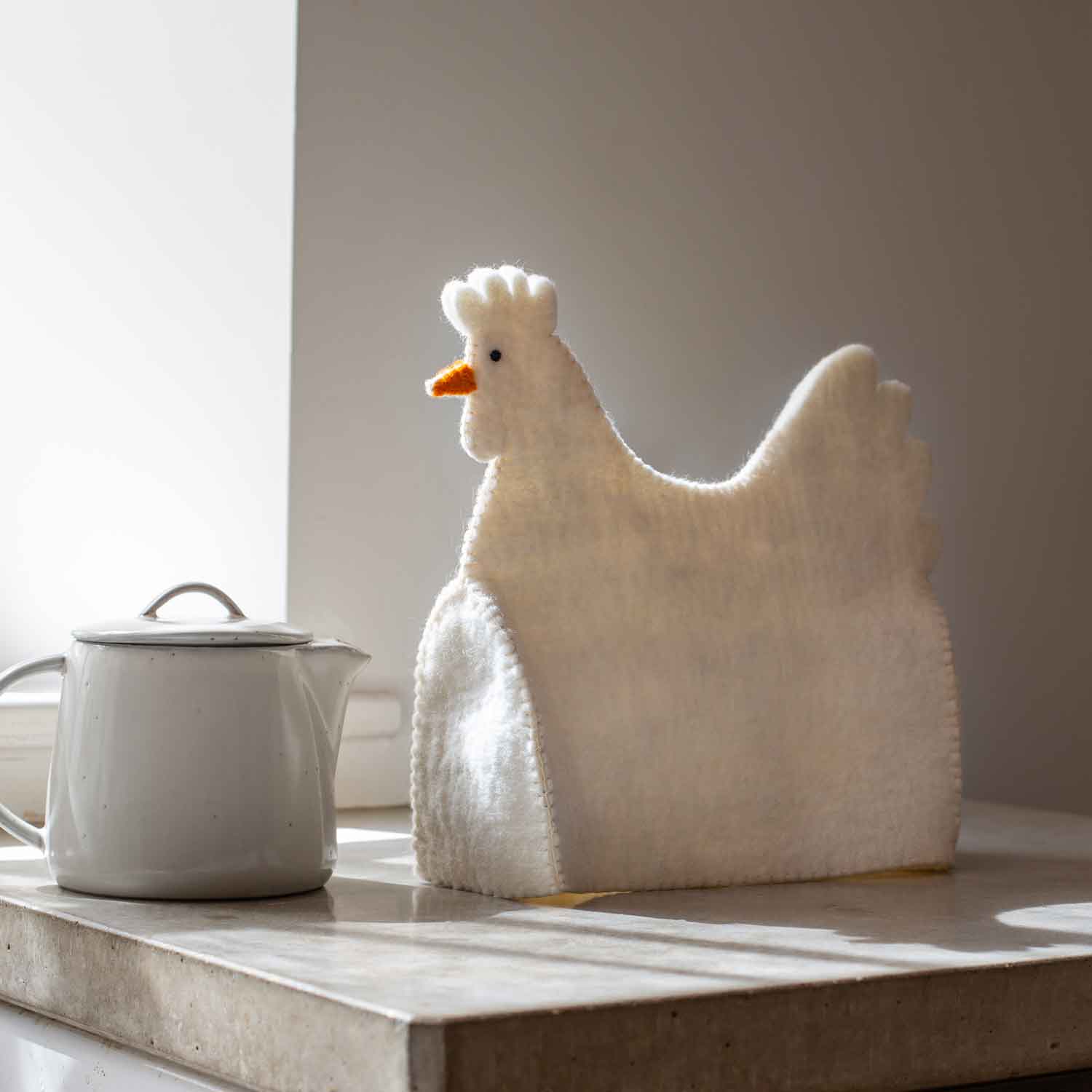 Photo of Graham and green holly the hen tea cosy
