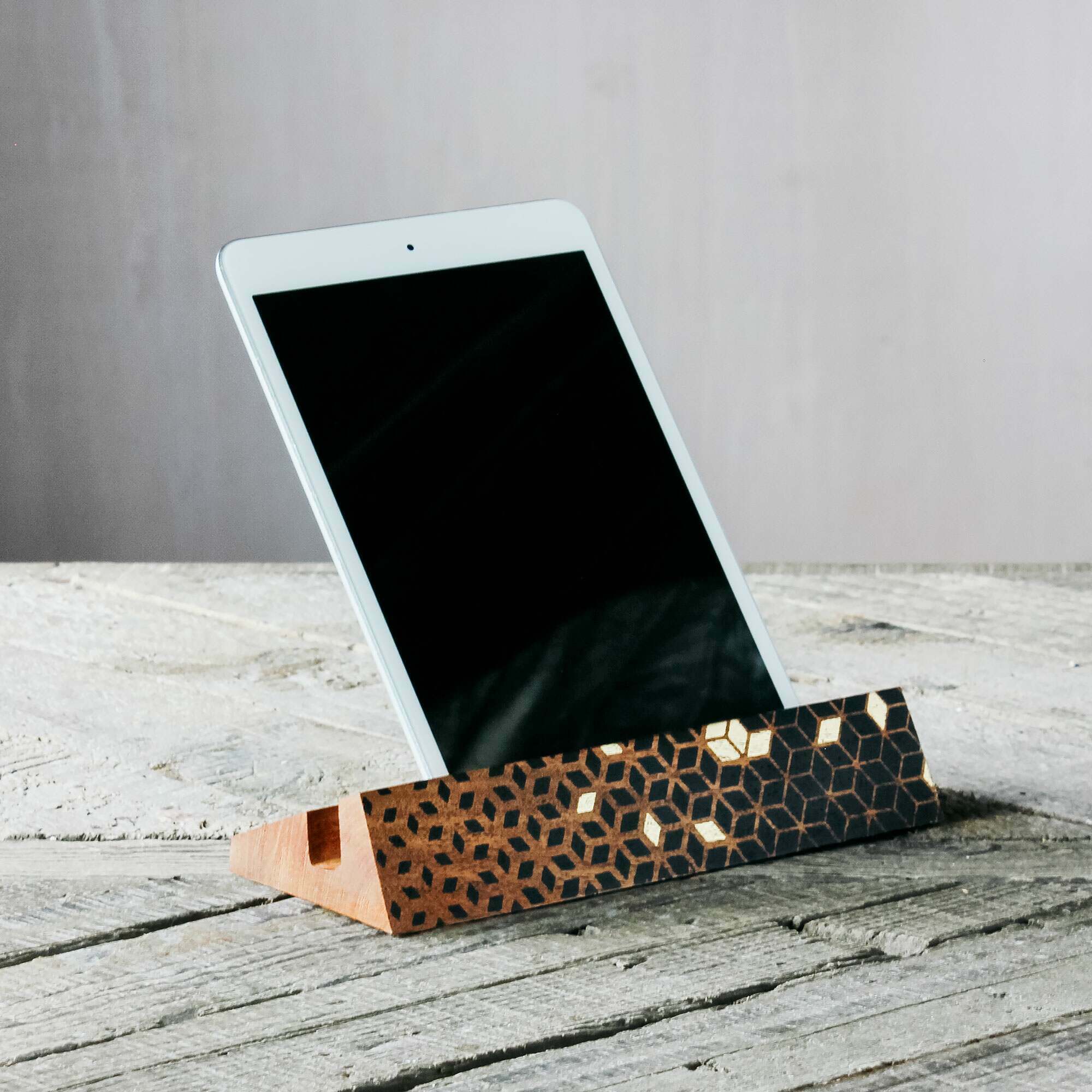 Photo of Graham and green black and gold cube patterned ipad stand