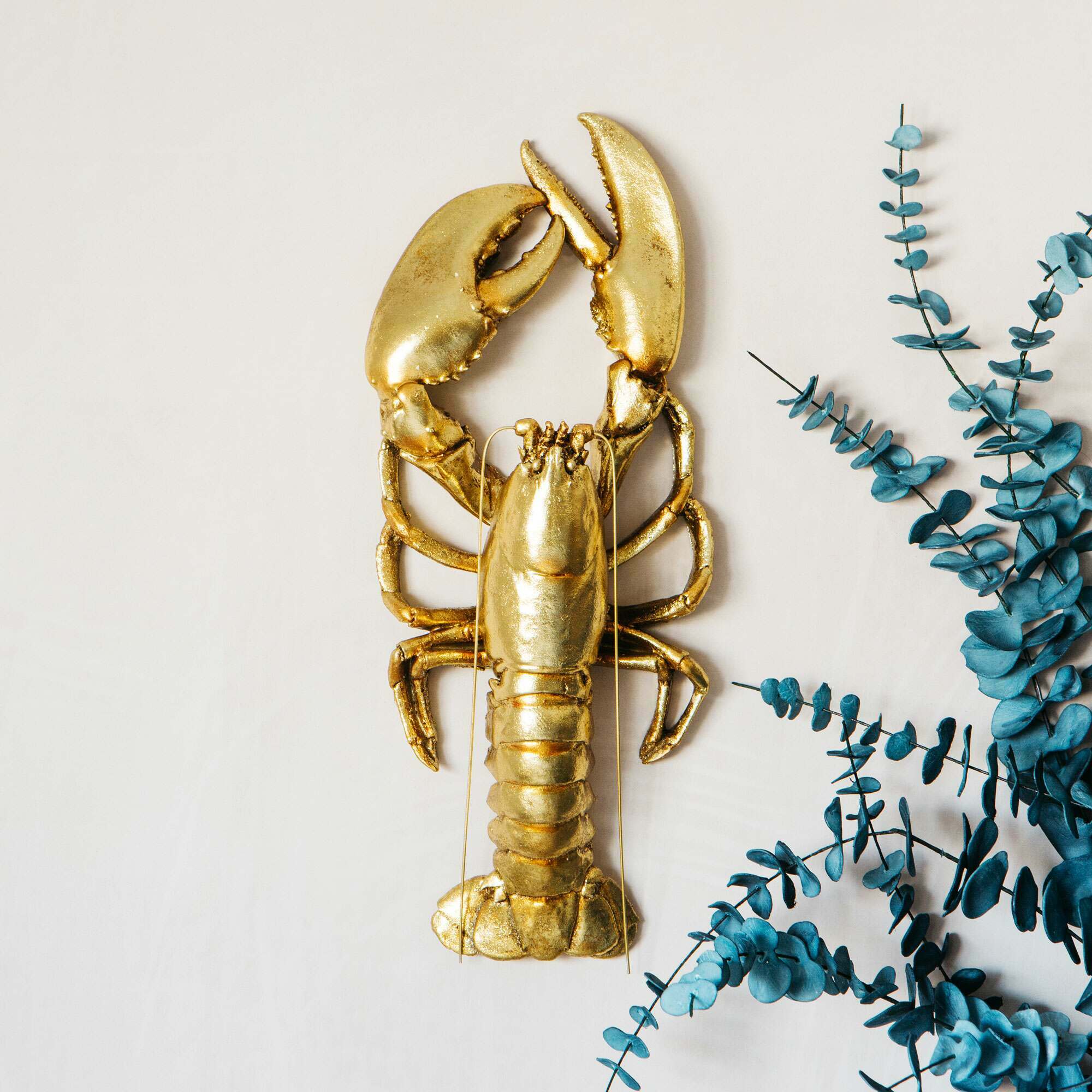 Photo of Graham and green gold lobster wall decor