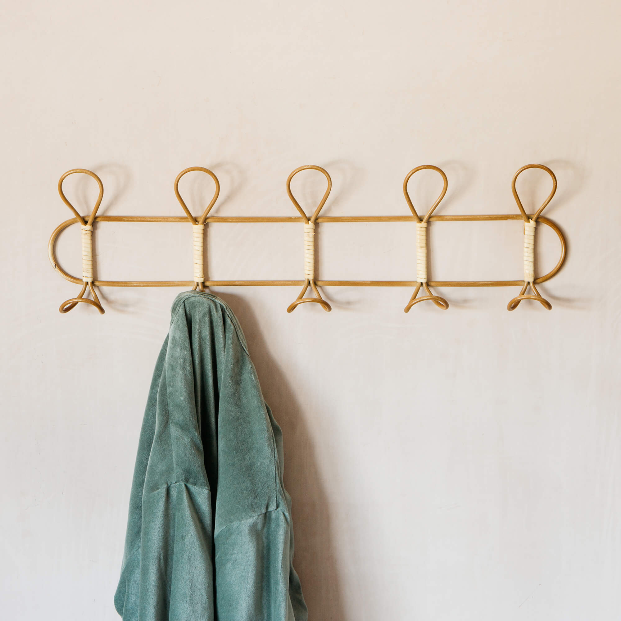Photo of Graham and green rattan and iron coat hooks