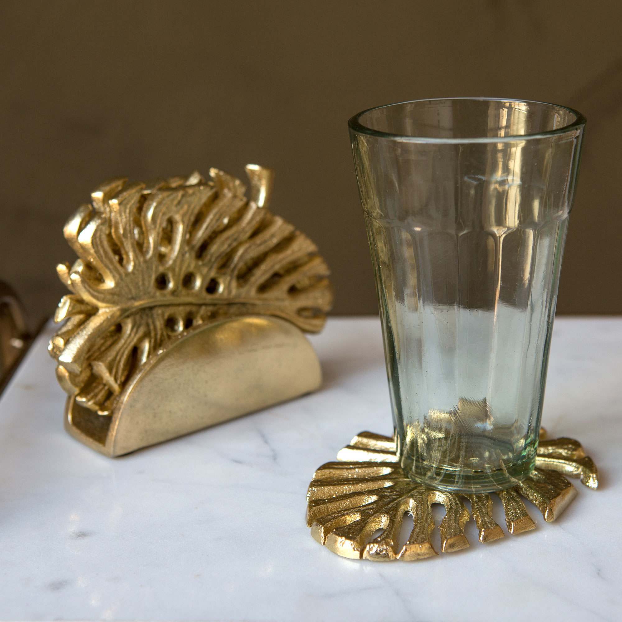 Read more about Graham and green set of four brass palm leaf coasters
