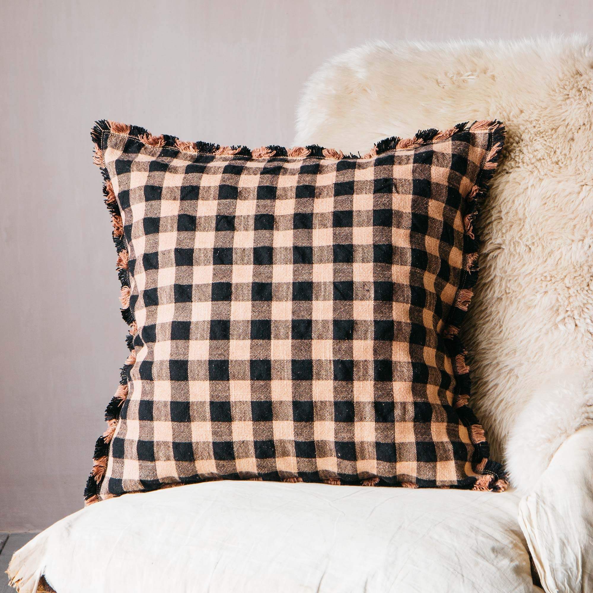 Read more about Graham and green black and peach gingham cushion