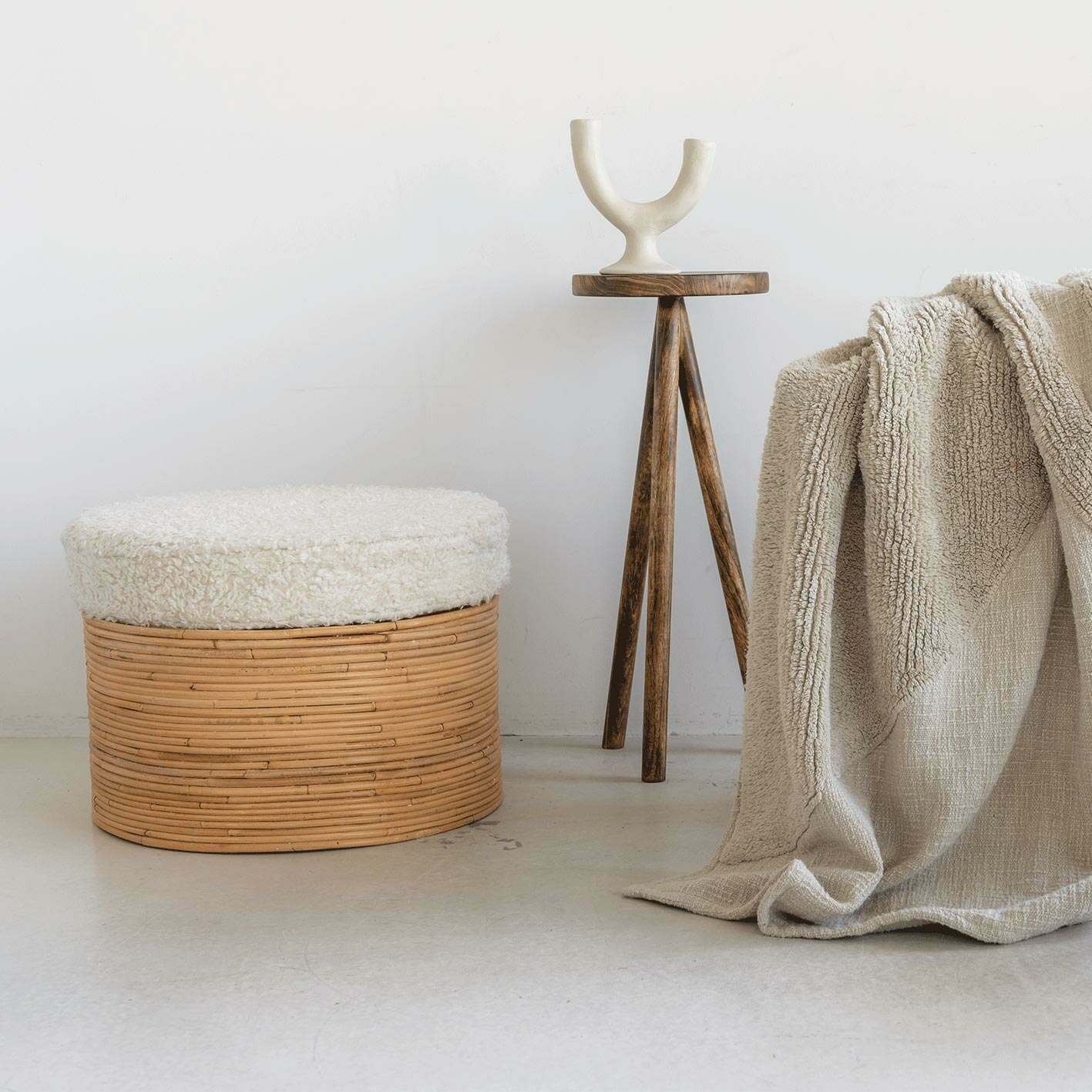 Photo of Graham and green rattan and sherpa pouffe